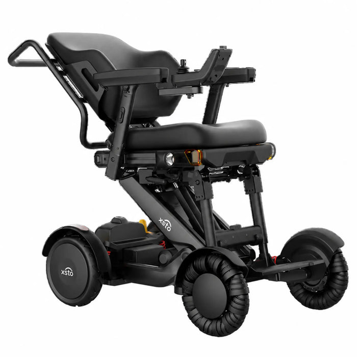 XSTO M4 Pro Smart Electric Wheelchair shown from a front three-quarter angle with the backrest reclined, emphasizing customizable positioning and comfort features.