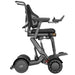 XSTO M4 Pro Smart Electric Wheelchair raised into its standing position, demonstrating powered seat elevation for improved reach, accessibility, and user interaction.